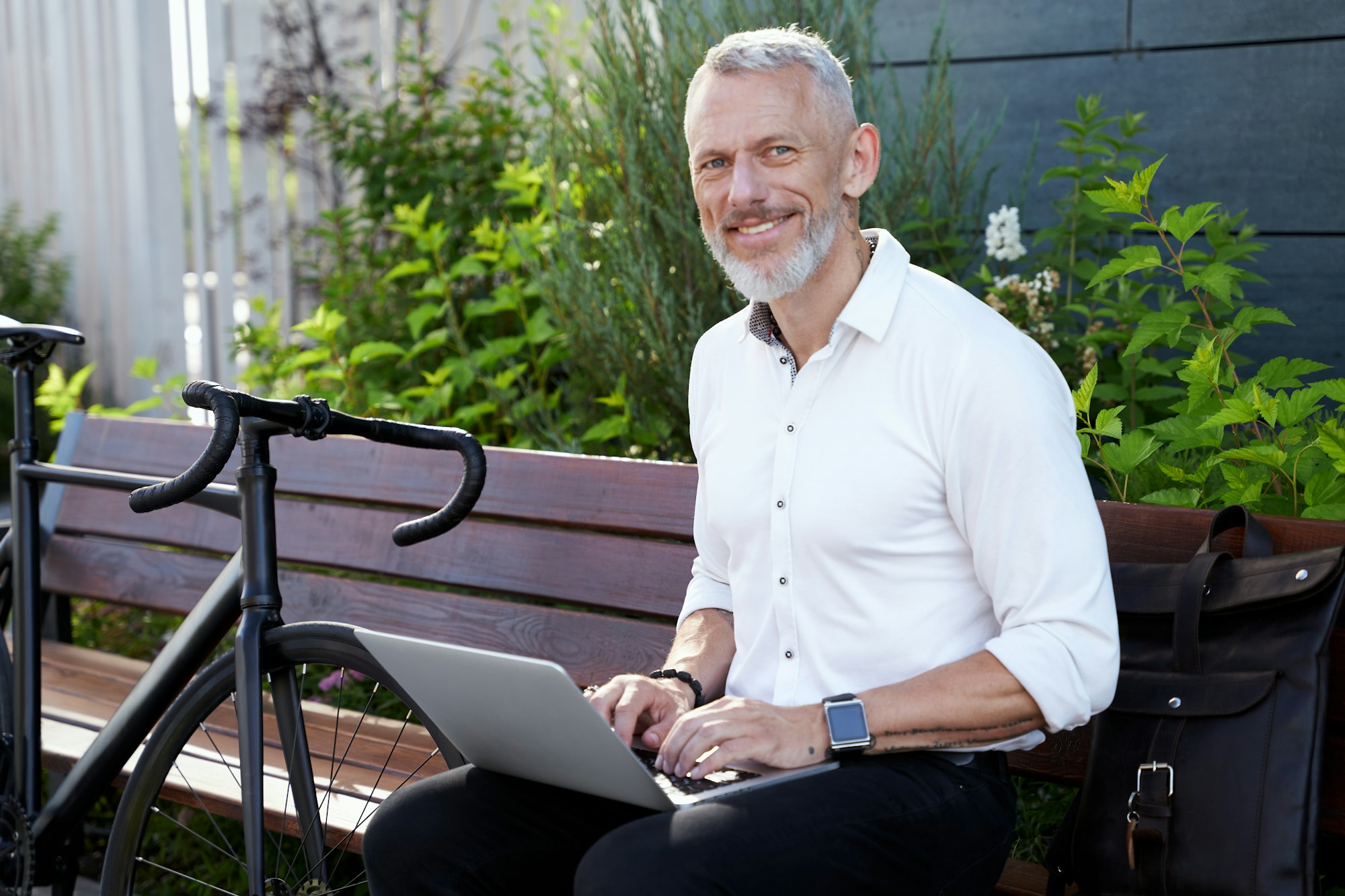 Building a Business. Successful modern middle aged businessman in stylish suit smiling at camera